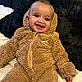 Ziggy joined the competition — help win amazing prizes! baby, smiling, child, onesie, hooded_clothing, fluffy_texture, cozy, indoor, portrait, cute, happy, infant, sitting, warm_clothing, fuzzy, face, person, bed, blanket, comfort