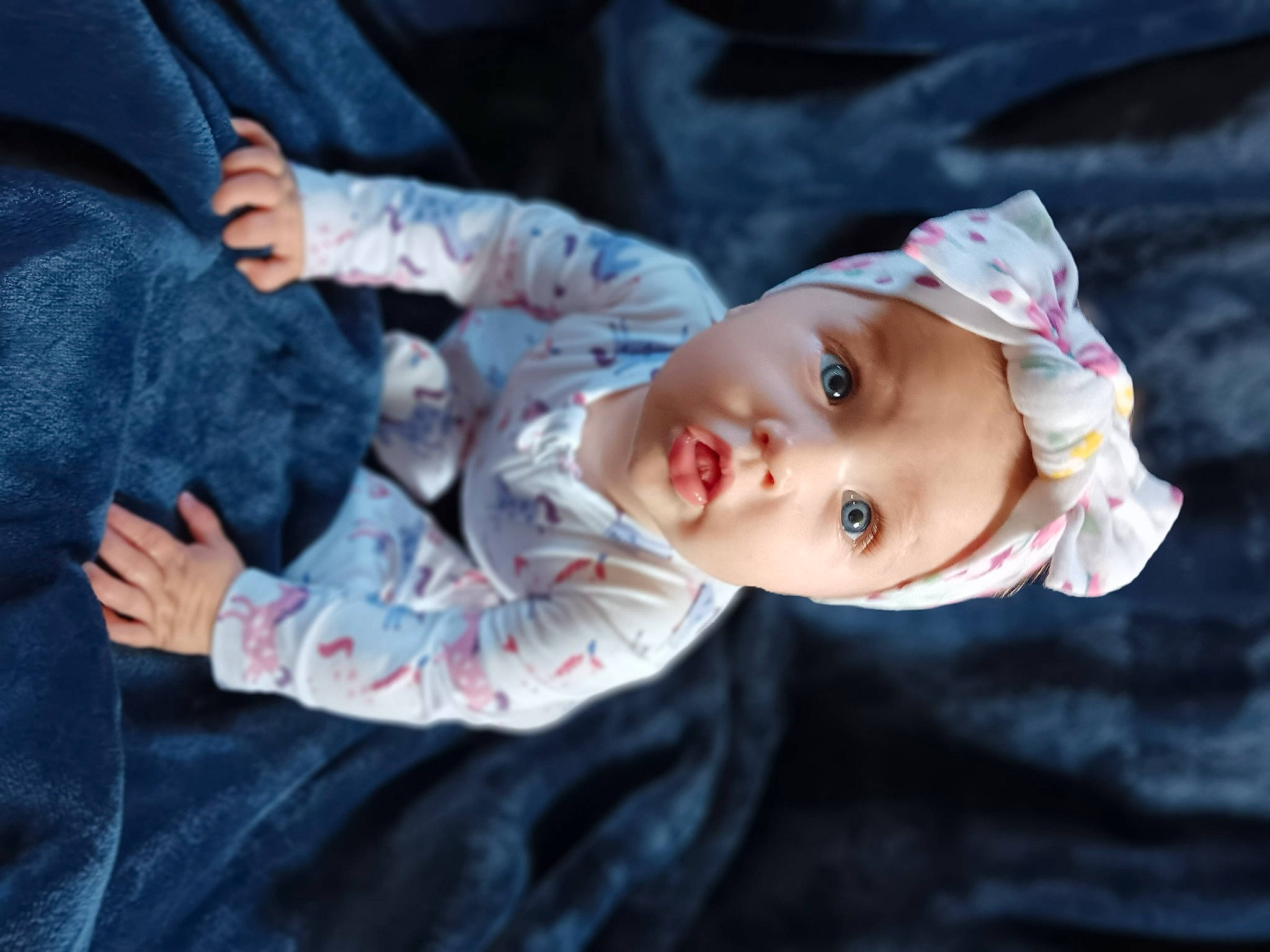 Alora is registered to the contest to win money with this photo: baby, baby_toddler_clothing, child, denim, flash_photography, fur, gesture, grass, happy, hat, headwear, mammal, person, plant, sitting, skin, sleeve, smile, surprise, toddler