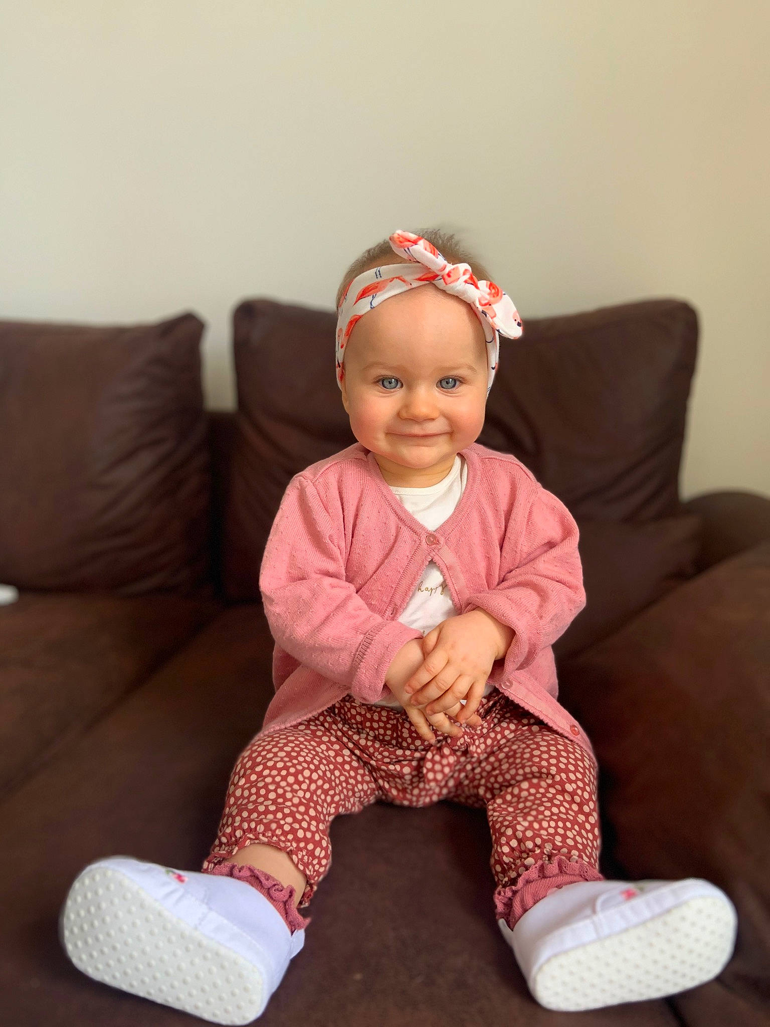 Sanny a rejoint le concours — aidez-le/la à gagner de superbes lots ! baby, baby_toddler_clothing, cap, cheek, child, comfort, face, happy, headwear, joy, lap, magenta, pattern, person, pink, shoe, sitting, skin, sleeve, smile