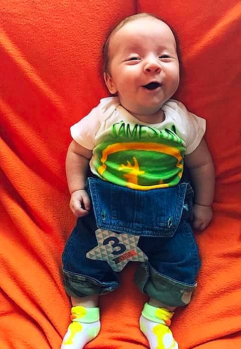 Jameson is registered to the contest to win money with this photo: baby_products, boy, child, cool, day, fun, infant, person, play, product, sitting, smile, textile, toddler, toy, yellow