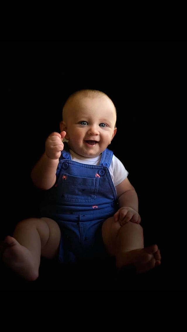 Dominik is registered to the contest to win money with this photo: arm, baby, blue, cheek, child, chin, finger, gesture, hand, head, human, mouth, nose, person, photography, portrait, portrait_photography, sitting, skin, standing