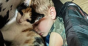 Willow joined the competition — help win amazing prizes! child, cat, calico_cat, sleeping, cuddling, pet, animal, portrait, indoors, blanket, bed, cozy, face, human, blond_hair, closed_eyes, whiskers, furry, companion, snuggling