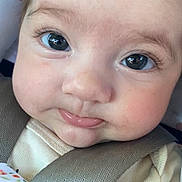 Nadia is registered to the contest to win money with this photo: baby, close_up, face, car_seat, child, infant, straps, safety, cute, tongue, eyes, expression, clothing, seatbelt, portrait, young_child, adorable, skin, head, person