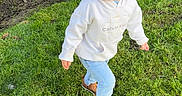 Leelend is registered to the contest to win money with this photo: child, toddler, grass, outdoor, smiling, happy, casual_clothing, hoodie, jeans, sneakers, playful, daylight, greenery, nature, person, young_child, running, lawn, sunlight, joy