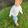 child, toddler, grass, outdoor, smiling, happy, casual_clothing, hoodie, jeans, sneakers, playful, daylight, greenery, nature, person, young_child, running, lawn, sunlight, joy