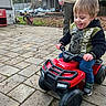 Leelend joined the competition — help win amazing prizes! toddler, child, toy, atv, red, outdoor, paved, backyard, adult, smiling, jacket, jurassic_world, vehicle, sidewalk, play, happy, person, casual, daylight, fun