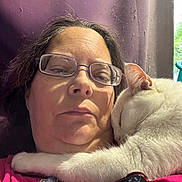 Diamond is registered to the contest to win money with this photo: woman, cat, white_cat, pet, cuddling, glasses, face, portrait, selfie, indoor, window, sunlight, purple_wall, pink_clothing, smartphone, pendant, fluffy, relaxed, closeup, companionship