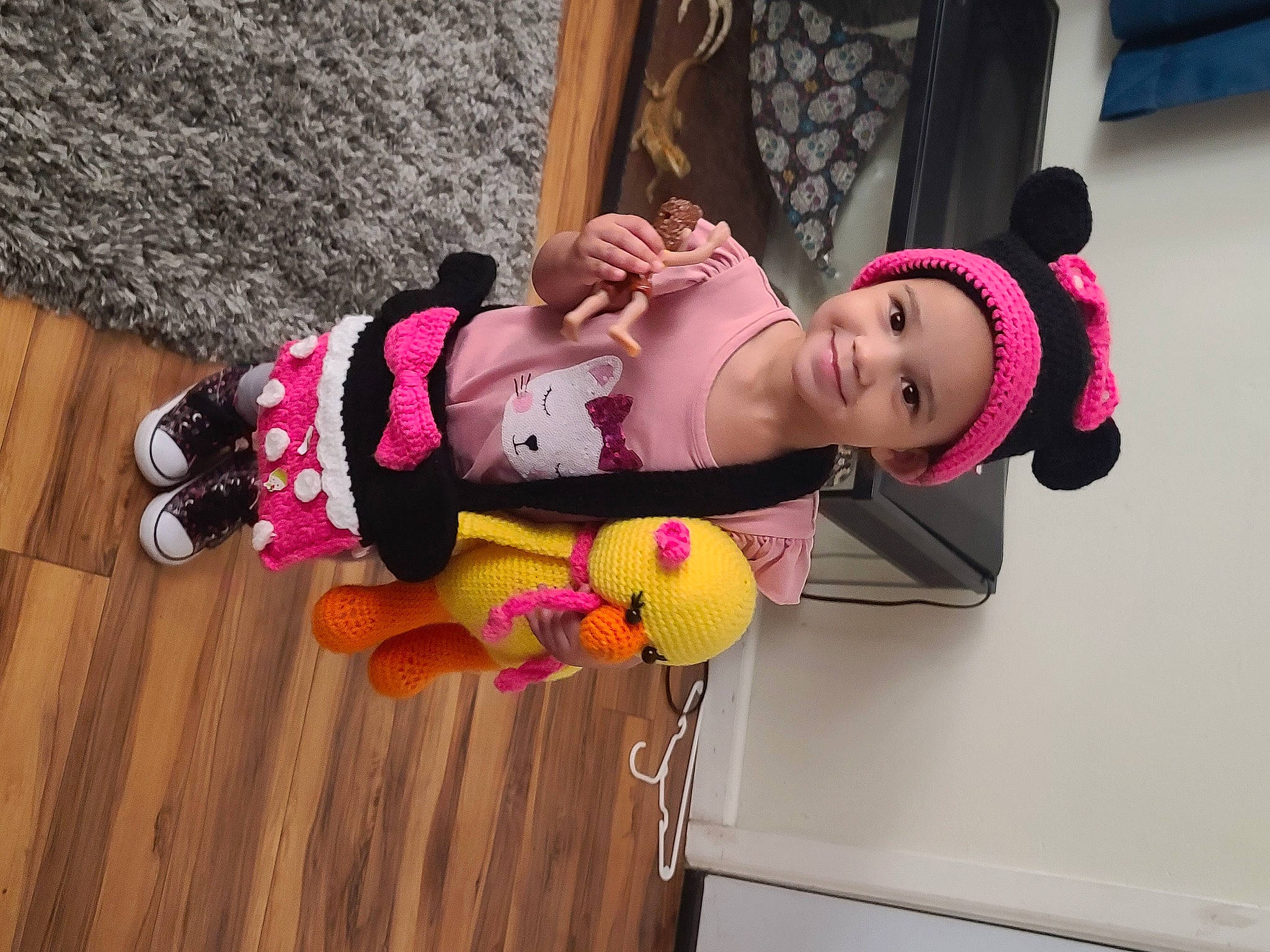 Syrenity is registered to the contest to win money with this photo: child, costume, fashion_accessory, flooring, fun, happy, hardwood, headwear, human_leg, jewellery, joy, magenta, person, pink, room, smile, sock, thigh, toddler, wood