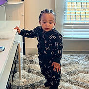 Jayden joined the competition — help win amazing prizes! child, toddler, standing, carpet, sneakers, window_blinds, living_room, tv_stand, hoodie, matching_outfit, braided_hair, curious_expression, hand_on_table, rug, flooring, interior, home_furniture, young_child, portrait, indoor