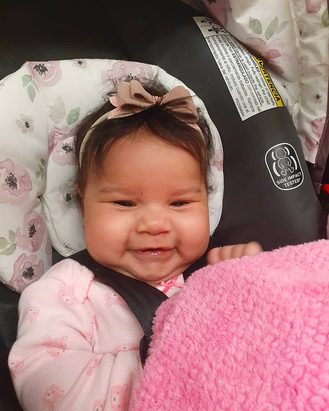 Kenley is registered to the contest to win money with this photo: baby, baby_products, beauty, car_seat, cheek, child, head, headgear, lip, person, pink, product, skin, smile, textile, toddler