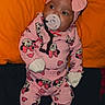 Azure is registered to the contest to win money with this photo: baby, infant, pacifier, pink_clothing, headband, bow, onesie, minnie_mouse, heart_pattern, lying_down, pillow, orange_background, socks, cute, child, indoor, portrait, young_child, soft_toys, sleepwear