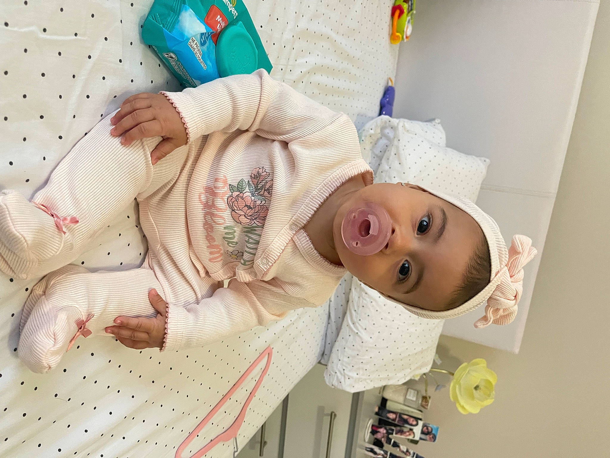 Amy joined the competition — help win amazing prizes! baby, baby_products, baby_sleeping, baby_toddler_clothing, bedding, child, comfort, fashion_accessory, hat, headgear, linens, pattern, peach, person, pink, room, sleeve, smile, textile, toddler
