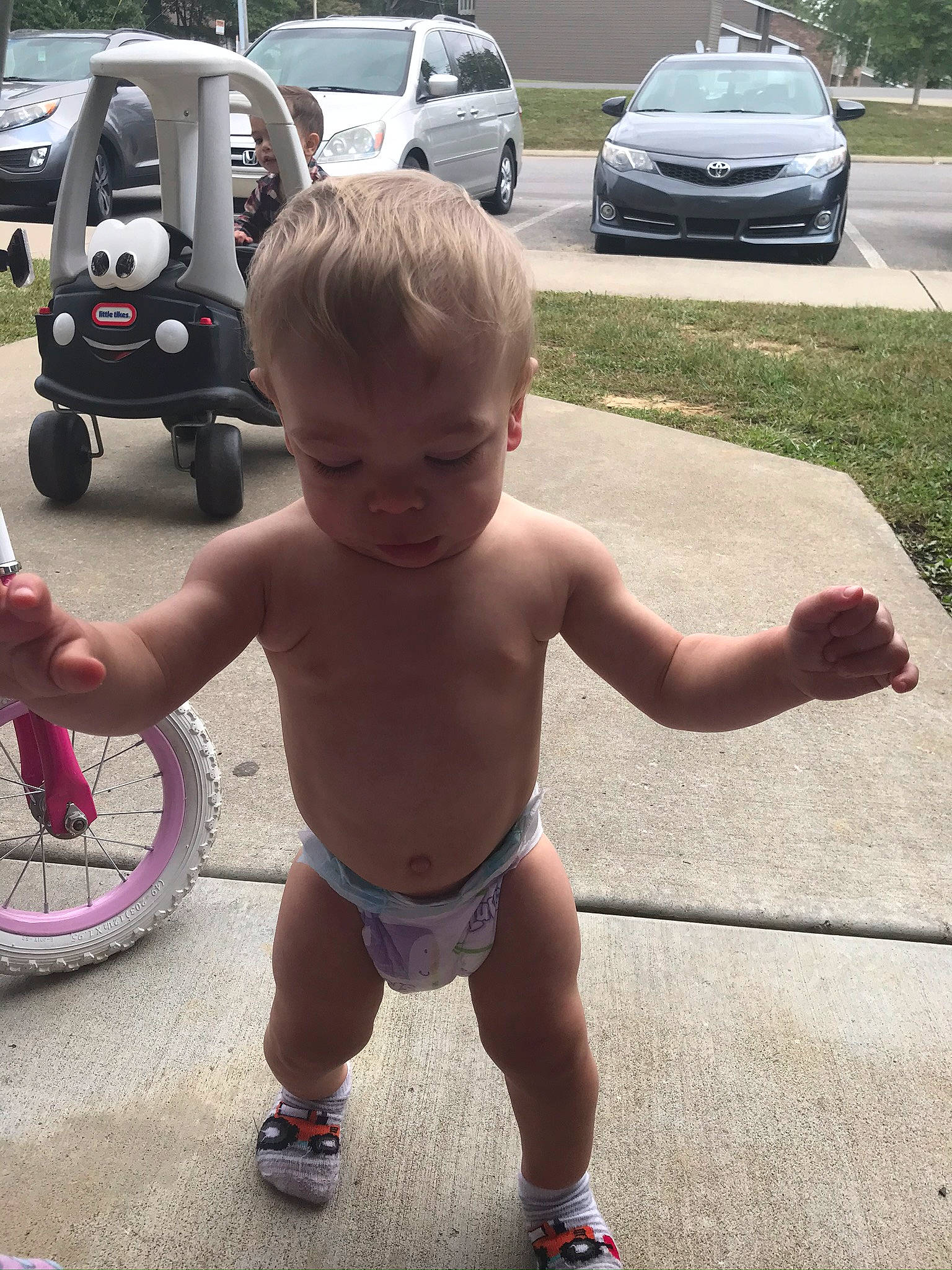 Madilyn is registered to the contest to win money with this photo: automotive_window_part, baby, barechested, car, child, city_car, compact_car, cool, family_car, minivan, person, subcompact_car, summer, thumb, toddler, vacation, vehicle, vehicle_door, washing