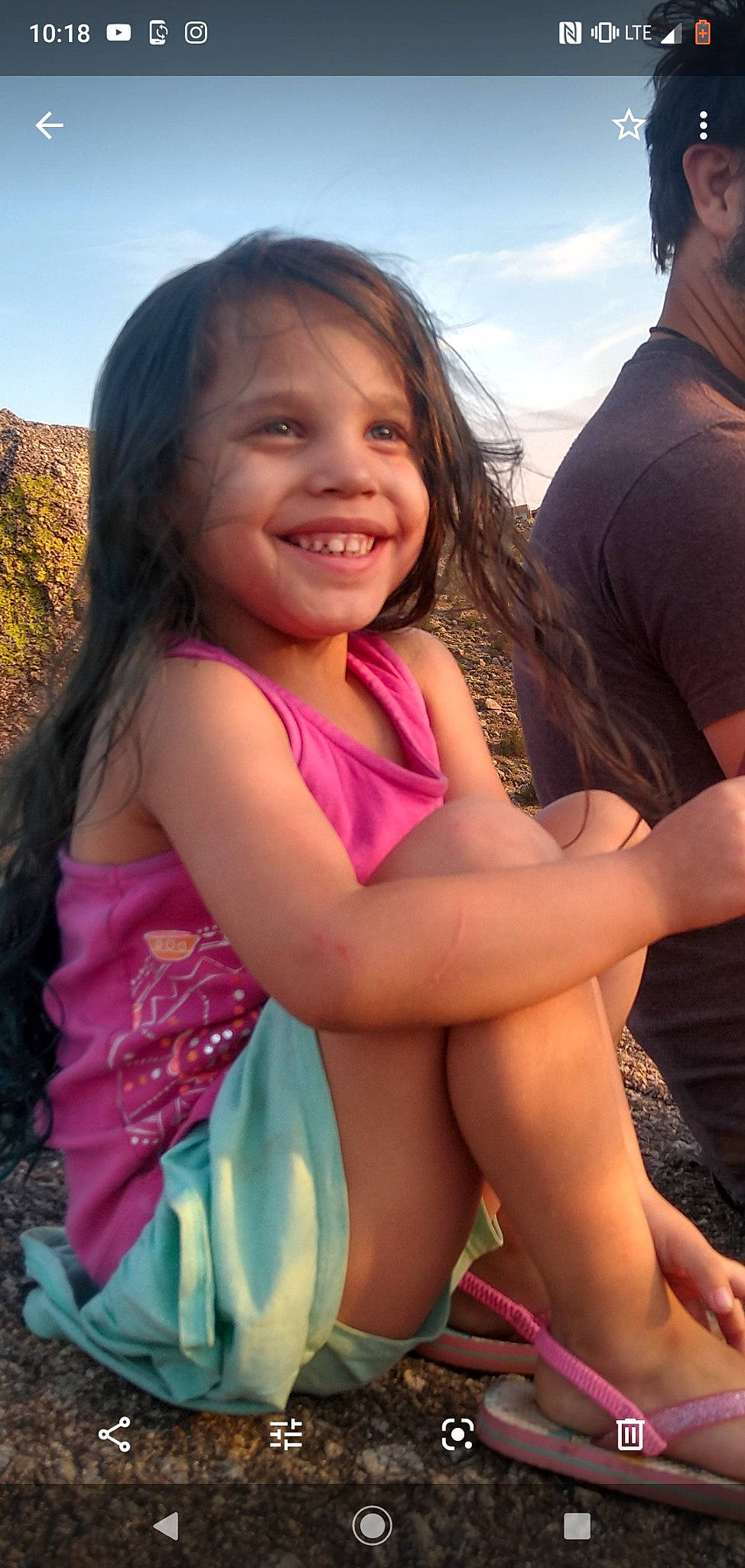 Effie joined the competition — help win amazing prizes! facial_expression, fashion, grass, hairstyle, happy, human, human_body, joy, leisure, muscle, people_in_nature, person, pink, plant, shorts, shoulder, skin, sky, smile, swimwear