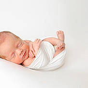 Ryan is registered to the contest to win money with this photo: newborn, baby, sleeping, infant, wrapped, white_cloth, peaceful, soft, portrait, closeup, skin, tiny_hands, tiny_feet, resting, cute, fresh, new_life, studio, minimalist, calm