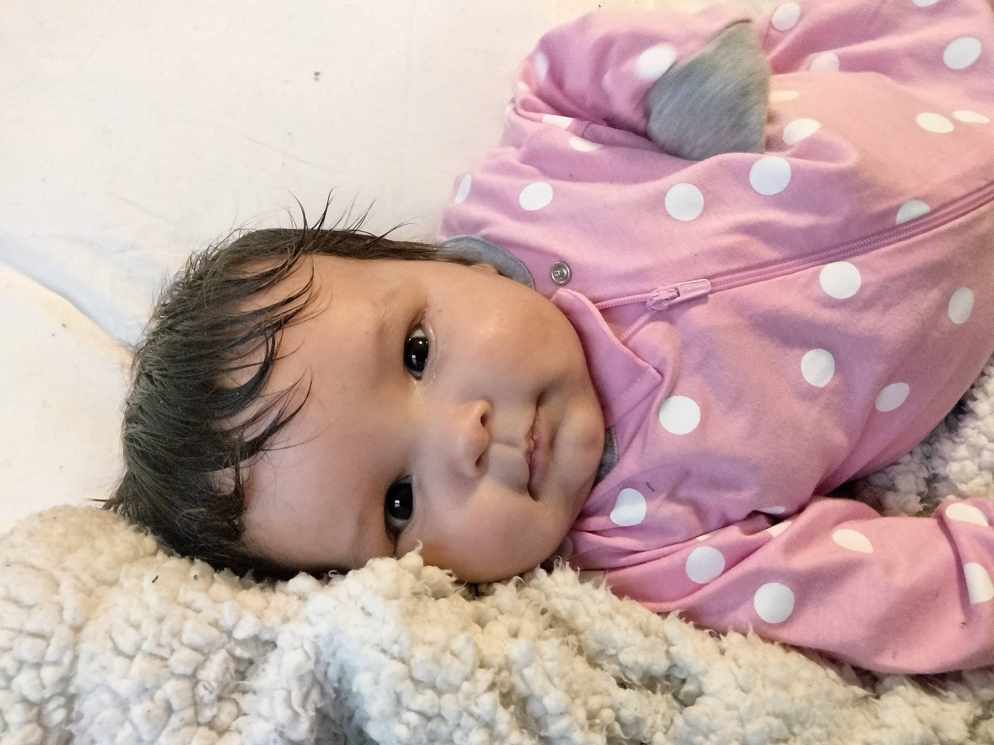 Jasmilee joined the competition — help win amazing prizes! baby, baby_toddler_clothing, beanie, cap, cheek, child, eyelash, fashion_accessory, fur, headgear, knit_cap, linens, pattern, person, pink, portrait_photography, skin, sleeve, textile, toddler