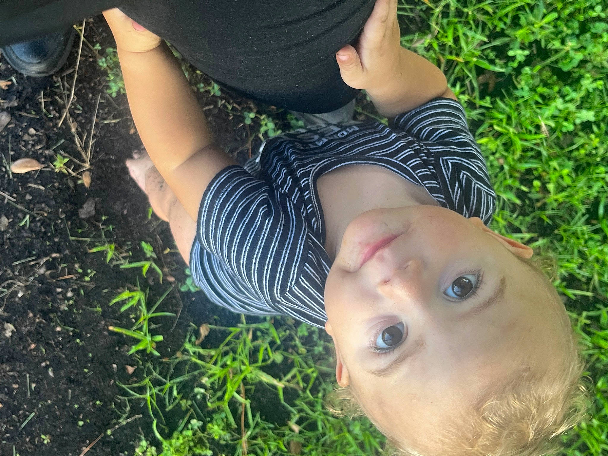 Ethan Tappen joined the competition — help win amazing prizes! baby_toddler_clothing, child, elbow, fun, grass, grass_family, grassland, happy, hat, human_leg, meadow, pattern, people_in_nature, person, plant, prairie, sitting, soil, toddler, tree