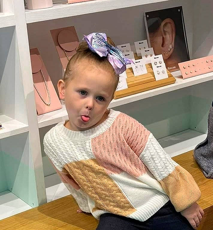 Zoey joined the competition — help win amazing prizes! baby, baby_toddler_clothing, child, comfort, desk, ear, eyelash, fashion_accessory, fashion_design, flooring, fur, hardwood, pattern, person, room, sitting, sleeve, toddler, wood, wool