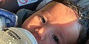 Xavian joined the competition — help win amazing prizes! baby, blanket, bottle, car_seat, caring, child, closeup, face, feeding, fur, infant, milk, person, portrait, seatbelt, soft, sunlight, toddler, warm, young