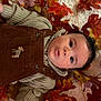 Xavian joined the competition — help win amazing prizes! autumn, baby, brown_clothing, child, cozy, curious, cute, expression, face, fall_leaves, indoor, infant, knit_sweater, laying_down, orange_leaves, overalls, portrait, seasonal, warm_clothing, young_child