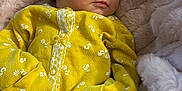 Kinsley joined the competition — help win amazing prizes! baby, newborn, yellow_clothing, floral_pattern, blanket, soft_texture, infant, cute, sleepwear, portrait, cozy, small_hands, face, head, resting, indoors, peaceful, warm, comfort, child
