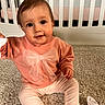 baby, child, infant, sitting, carpet, crib, pink_sweater, bow, pants, sock, foot, indoor, portrait, cute, smile, face, eyes, hand, furniture, home