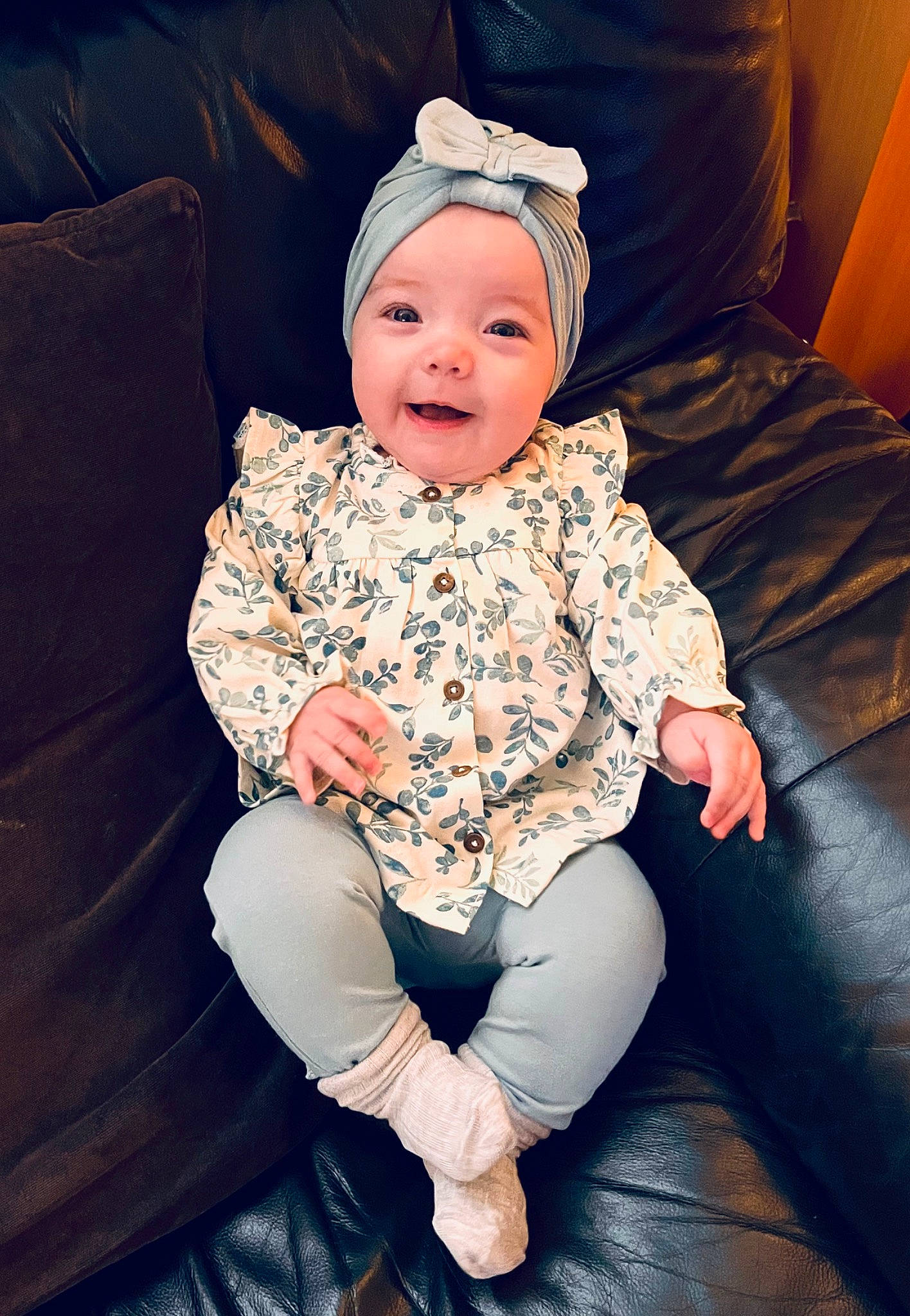 Eilidh is registered to the contest to win money with this photo: baby, baby_toddler_clothing, comfort, cool, couch, eye, flash_photography, fun, happy, headwear, human_body, human_leg, lap, person, purple, shoe, skin, sleeve, smile, t_shirt