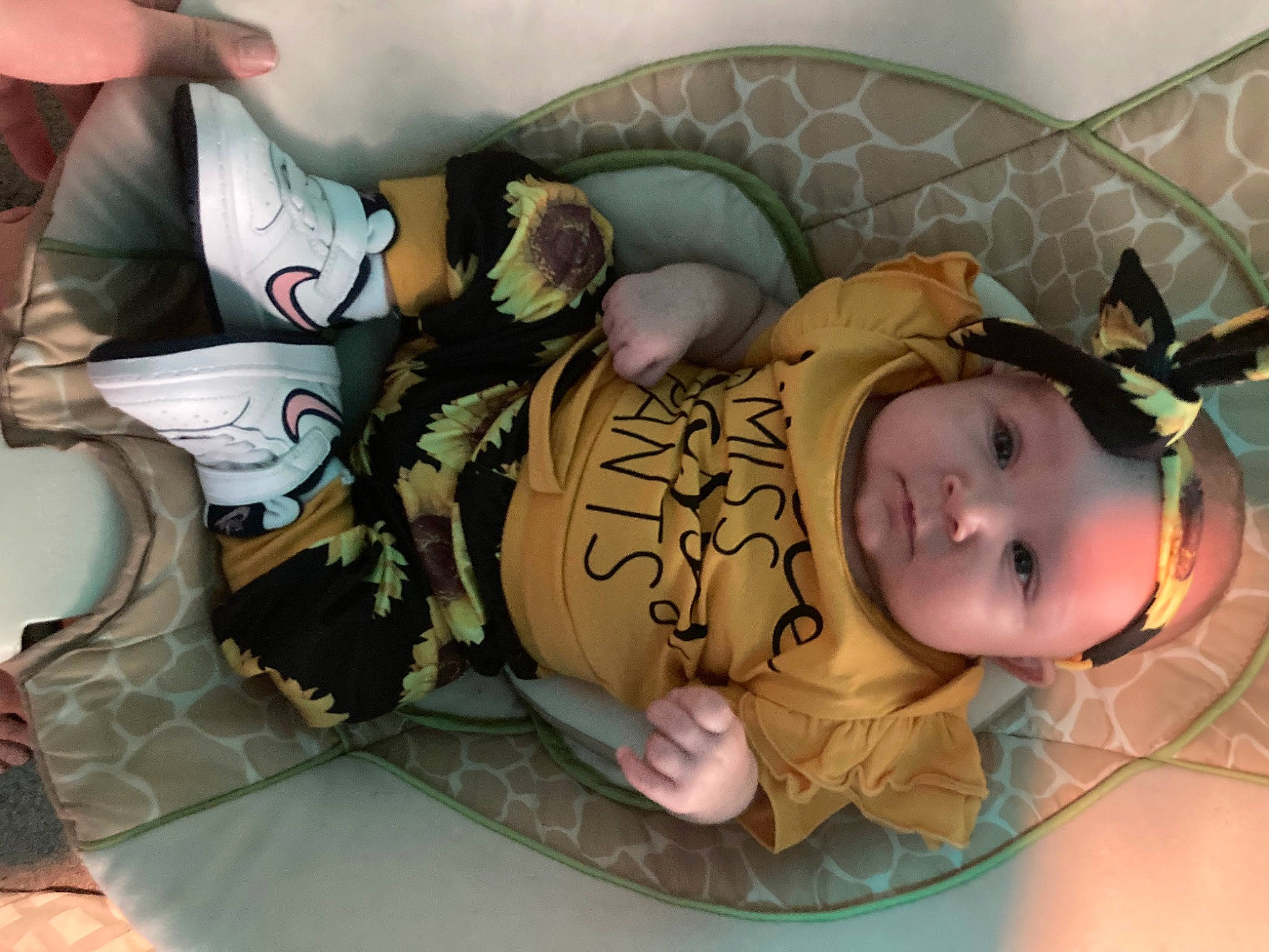 Ariella joined the competition — help win amazing prizes! baby, baby_products, baby_safety, baby_sleeping, baby_toddler_clothing, cheek, child, comfort, fun, grass, happy, headgear, headwear, human_body, linens, mouth, pattern, person, room, sitting