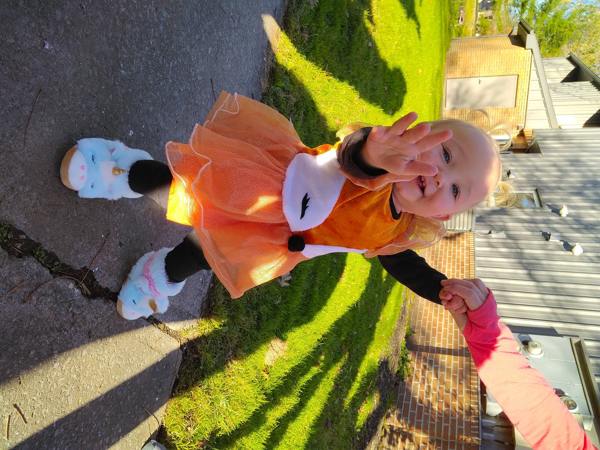 Ariella is registered to the contest to win money with this photo: asphalt, event, fun, grass, happy, hat, leaf, leisure, pattern, person, plant, recreation, road_surface, shadow, smile, sunglasses, toddler, tree, walking_shoe