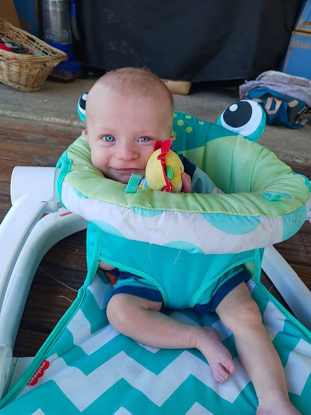 Talon is registered to the contest to win money with this photo: aqua, baby, baby_products, baby_toddler_clothing, blue, chair, child, comfort, electric_blue, fun, human_leg, lap, leisure, person, play, recreation, room, sitting, storage_basket, thigh