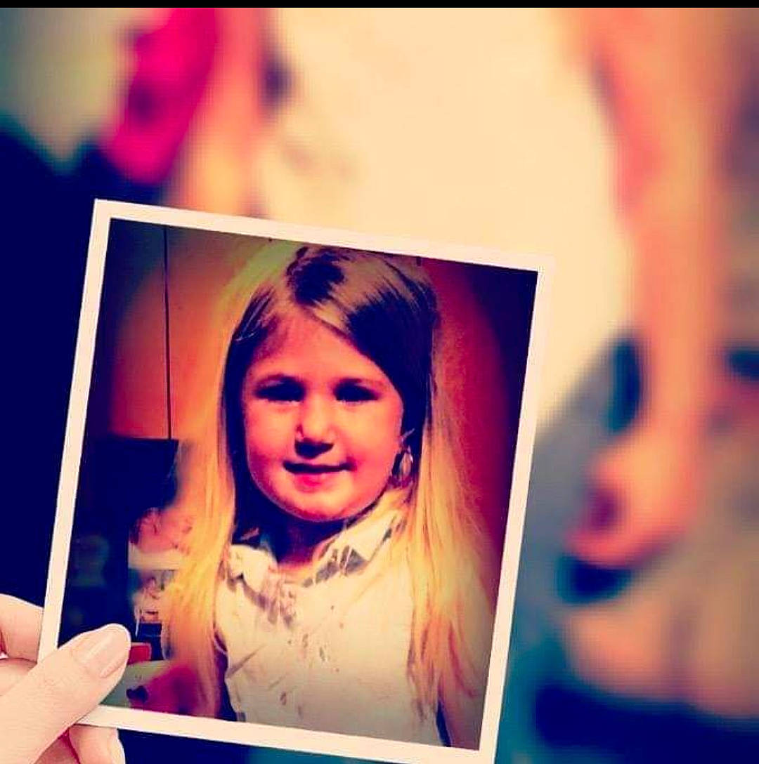 Danica is registered to the contest to win money with this photo: blond, child, cloud, eyelash, flash_photography, font, fun, gesture, hair, happy, head, joy, magenta, person, photograph, purple, rectangle, sky, smile, tints_and_shades