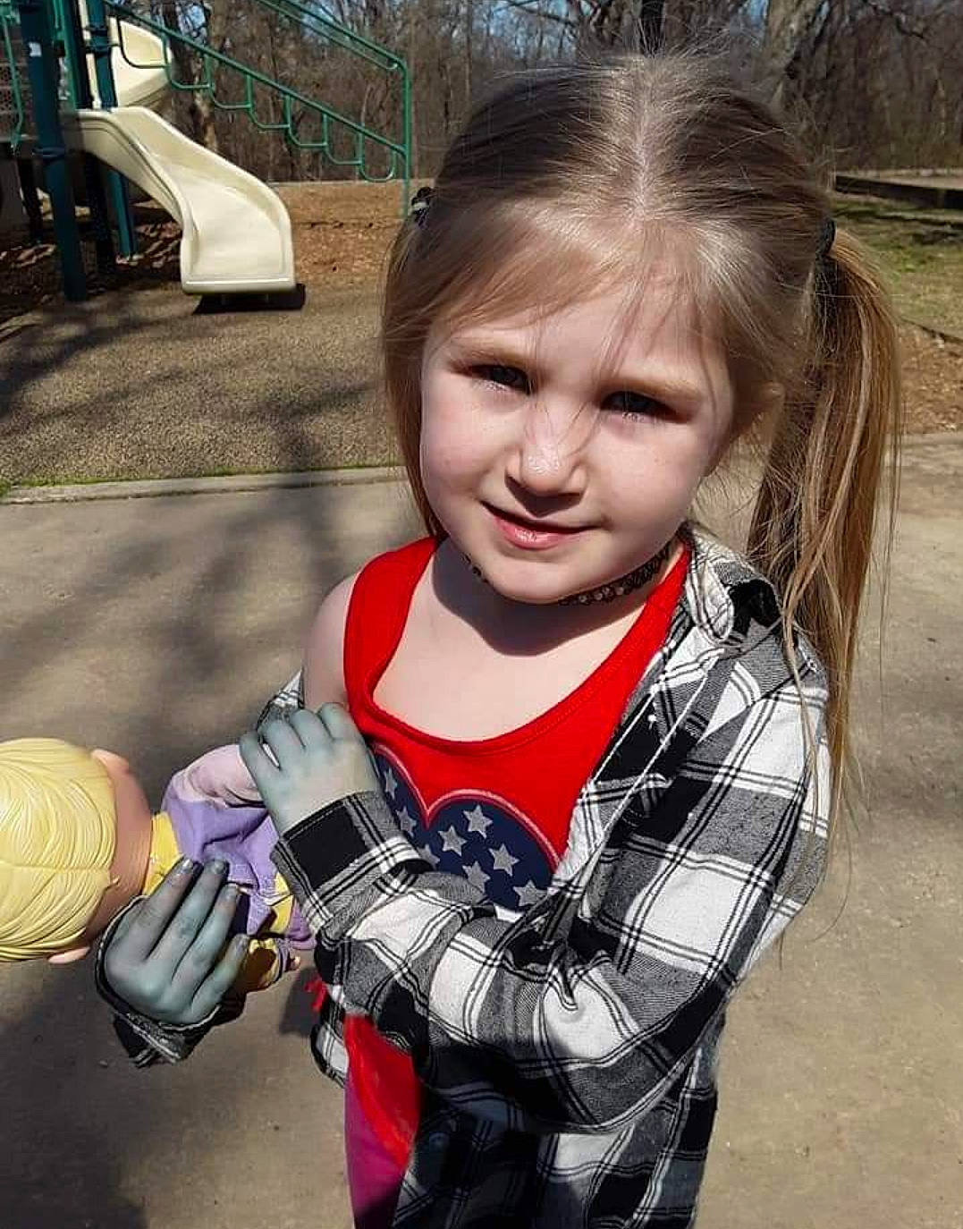 Danica joined the competition — help win amazing prizes! brown_hair, child, facial_expression, fun, glove, grass, happy, helmet, jewellery, pattern, person, personal_protective_equipment, plaid, play, portrait_photography, recreation, sitting, t_shirt, toddler, tree