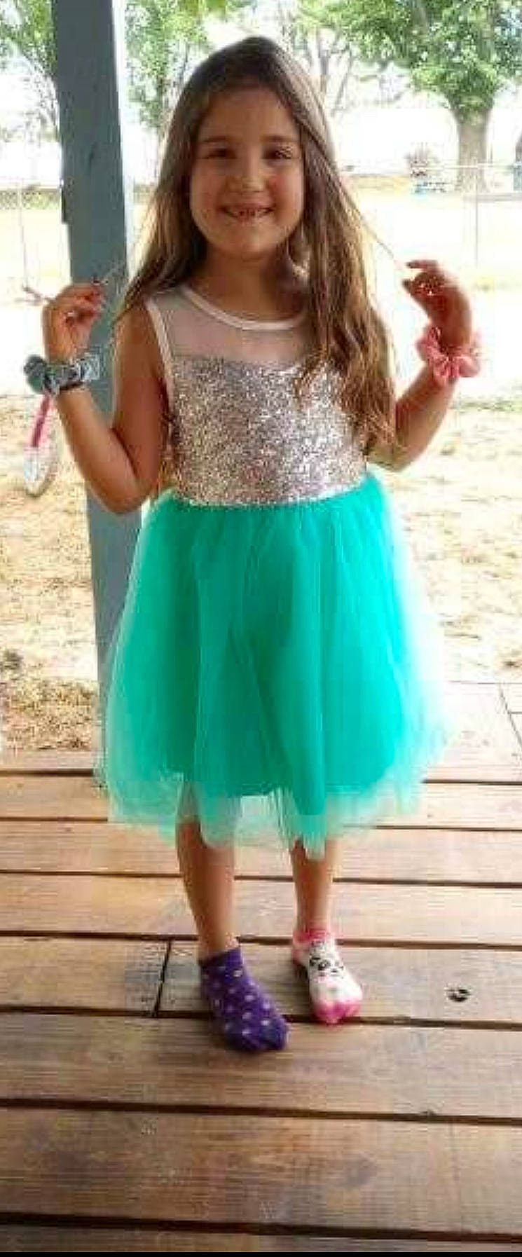 Phoenix is registered to the contest to win money with this photo: aqua, azure, blue, day_dress, dress, electric_blue, formal_wear, green, joint, joy, knee, neck, one_piece_garment, person, pink, shoulder, sleeve, sleeveless_shirt, standing, thigh