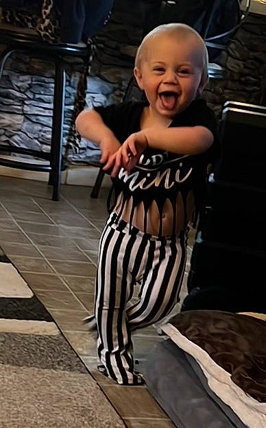 Emberlyn is registered to the contest to win money with this photo: baby, baby_toddler_clothing, child, face, fashion_design, flash_photography, flooring, fun, happy, human_leg, monochrome_photography, pattern, person, sitting, sleeve, smile, t_shirt, thigh, toddler, waist