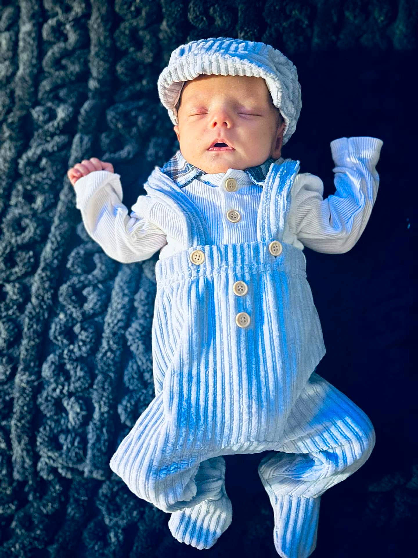Harlow joined the competition — help win amazing prizes! baby, beanie, blanket, bonnet, cap, clothing, face, hat, head, newborn, pajamas, pants, person, photography, portrait, sitting, sleeve, yawning