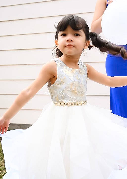 Christabell is registered to the contest to win money with this photo: abdomen, baby_toddler_clothing, balloon, bridal_clothing, bridal_party_dress, dress, flash_photography, formal_wear, gesture, gown, happy, joint, neck, person, pink, shoulder, sleeve, textile, toddler, waist