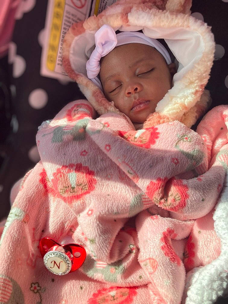 Nevaeh joined the competition — help win amazing prizes! baby, baby_products, baby_sleeping, baby_toddler_clothing, carmine, cheek, comfort, event, face, happy, hat, head, headgear, headwear, linens, pattern, person, pink, red, skin