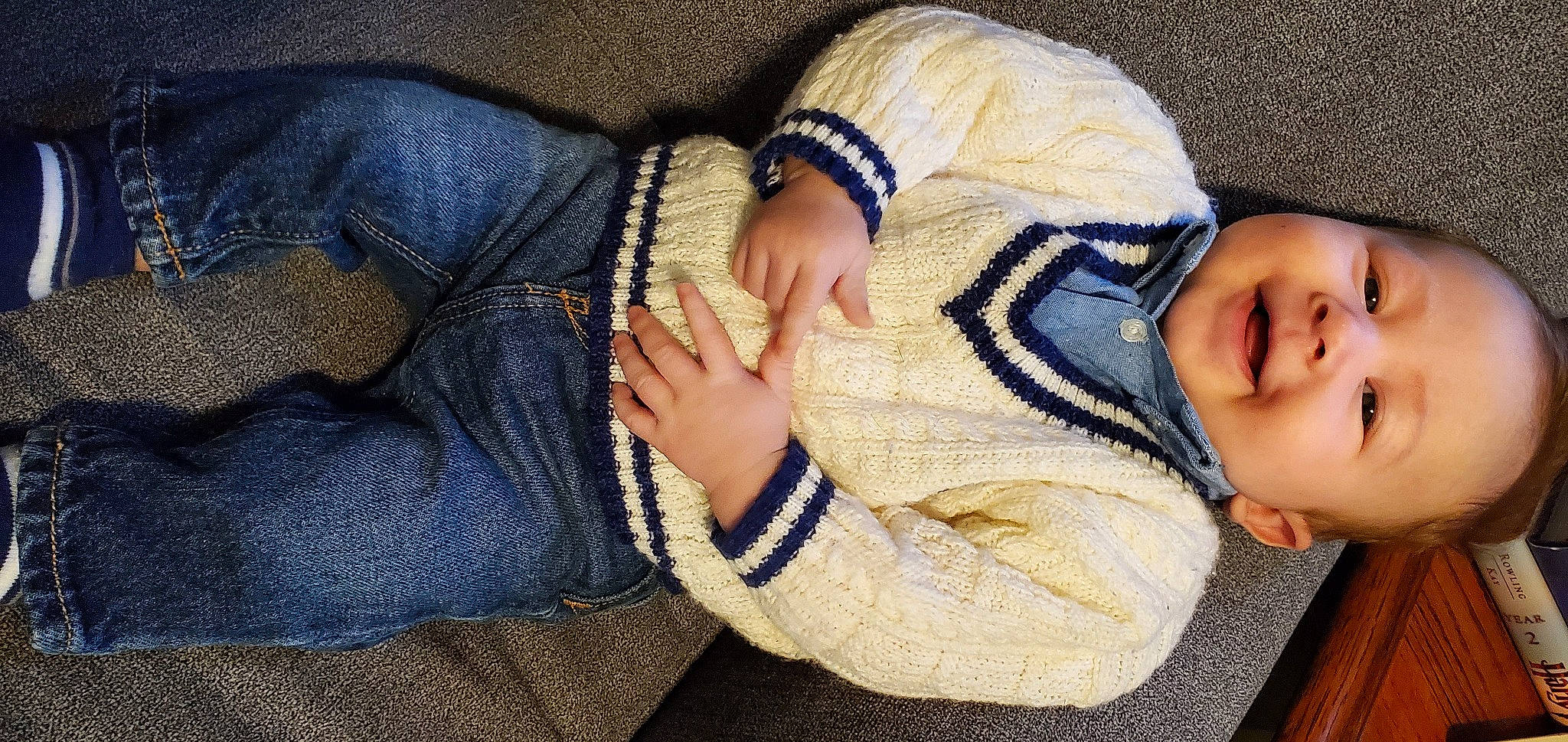 Drake is registered to the contest to win money with this photo: baby, comfort, elbow, eye, eyelash, gesture, glasses, hand, headgear, human_body, knee, leg, mouth, nail, person, skin, sunglasses, thigh, thumb, toddler