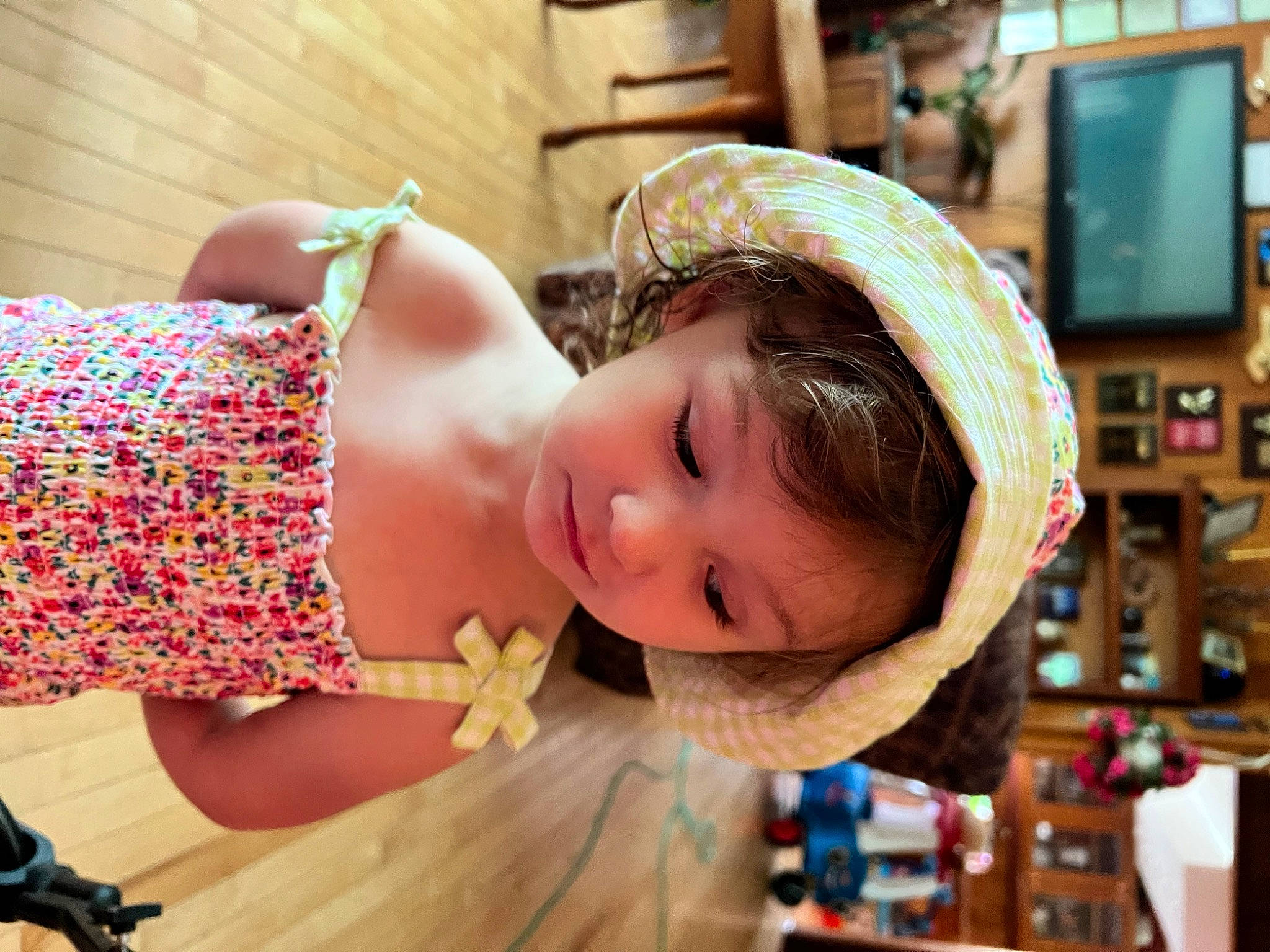 Lilly is registered to the contest to win money with this photo: baby, baby_toddler_clothing, child, eyelash, fashion_accessory, fun, happy, hat, headband, headgear, jewellery, leisure, pattern, person, play, room, sun_hat, television, toddler, vacation