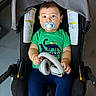 Axel joined the competition — help win amazing prizes! baby, pacifier, headphones, stroller, green_shirt, dinosaur_print, navy_leggings, child, infant, cute, indoors, seat, clothing, person, portrait, looking_at_camera, hands, feet, young_child, casual
