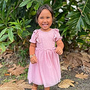 Kaniau is registered to the contest to win money with this photo: child, girl, smiling, pink_dress, outdoor, greenery, leaves, sandals, happy, young_child, nature, portrait, standing, sunlight, bracelet, short_hair, face, cute, fashion, daylight