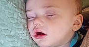 Oakley joined the competition — help win amazing prizes! baby, sleeping, blanket, soft, cozy, face, child, indoors, comfort, peaceful, closeup, head, pajamas, rest, nap, infant, cute, skin, expression, portrait