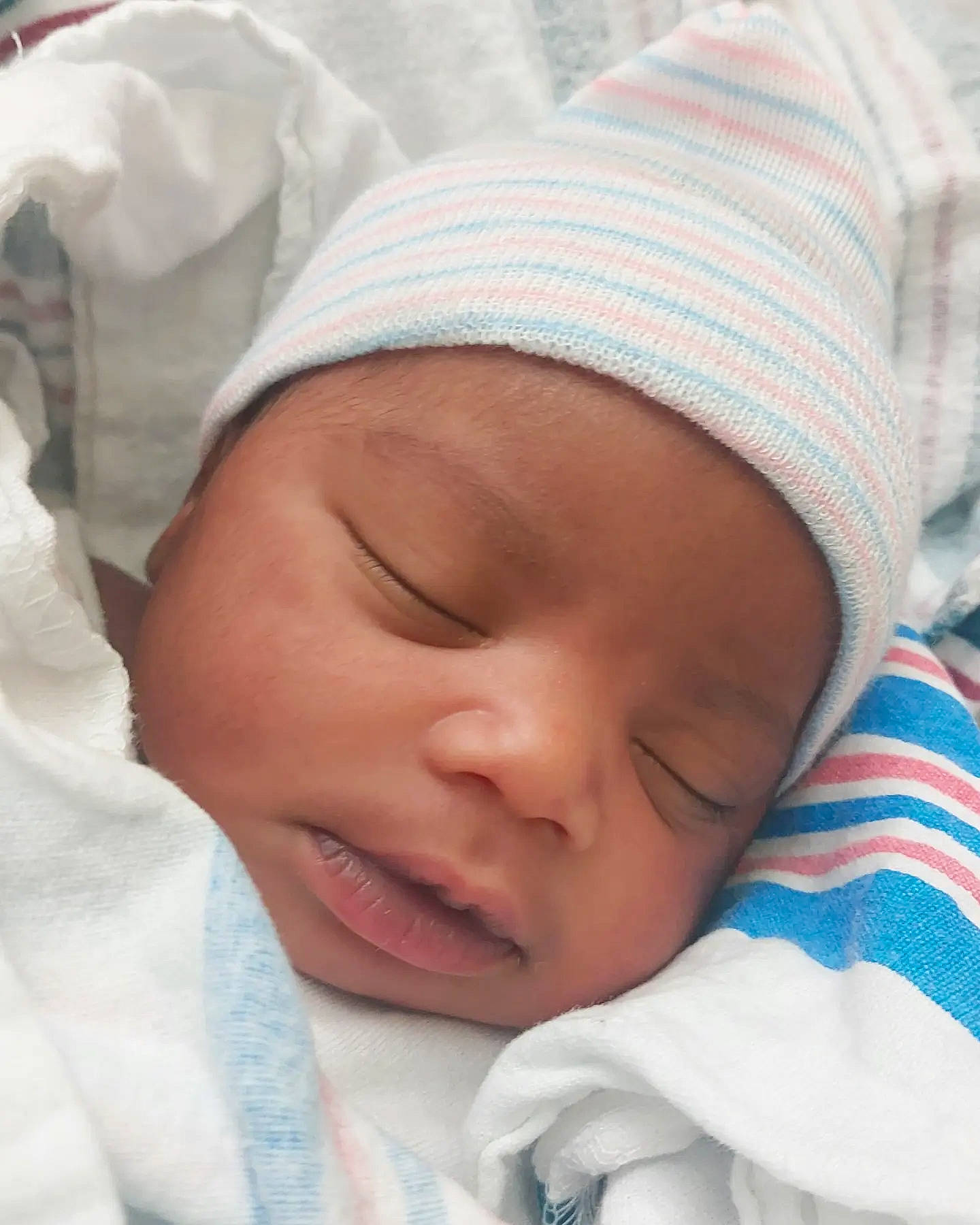 Aniyah joined the competition — help win amazing prizes! baby, baby_sleeping, bedtime, cheek, child, childbirth, comfort, happy, headwear, linens, nap, nose, person, portrait_photography, skin, sleep, smile, textile, thumb, toddler