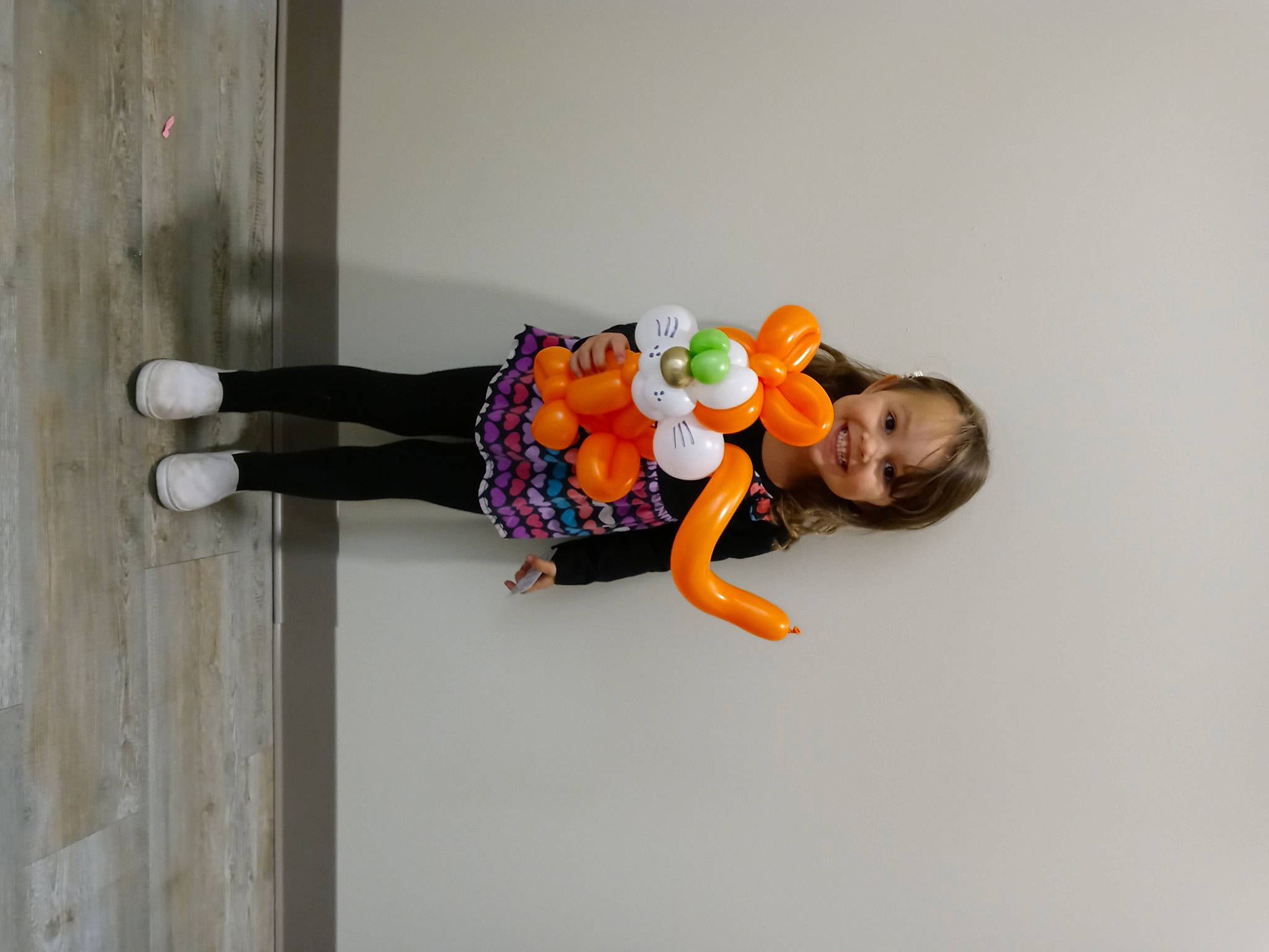 Mylayah is registered to the contest to win money with this photo: baby_toddler_clothing, child, comfort, dress, elbow, flooring, fun, happy, joy, knee, leg, person, plant, room, sitting, sleeve, smile, t_shirt, thigh, toddler