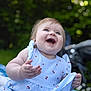 Maria a rejoint le concours — aidez-le/la à gagner de superbes lots ! baby, child, smiling, laughing, dress, blue, striped, cherry_print, outdoor, greenery, stroller, happy, cute, portrait, infant, skin, face, hand, sitting, joy