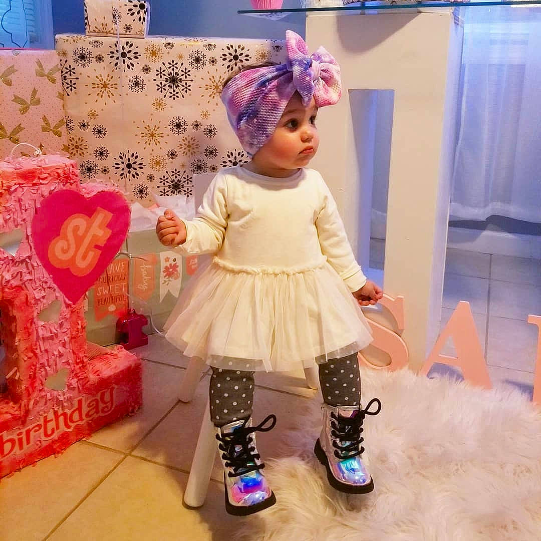 Luciana is registered to the contest to win money with this photo: child, costume, dress, fashion, fashion_accessory, fashion_design, footwear, person, pink, plant, shoe, sleeve, t_shirt, toddler, toy, wig, yellow