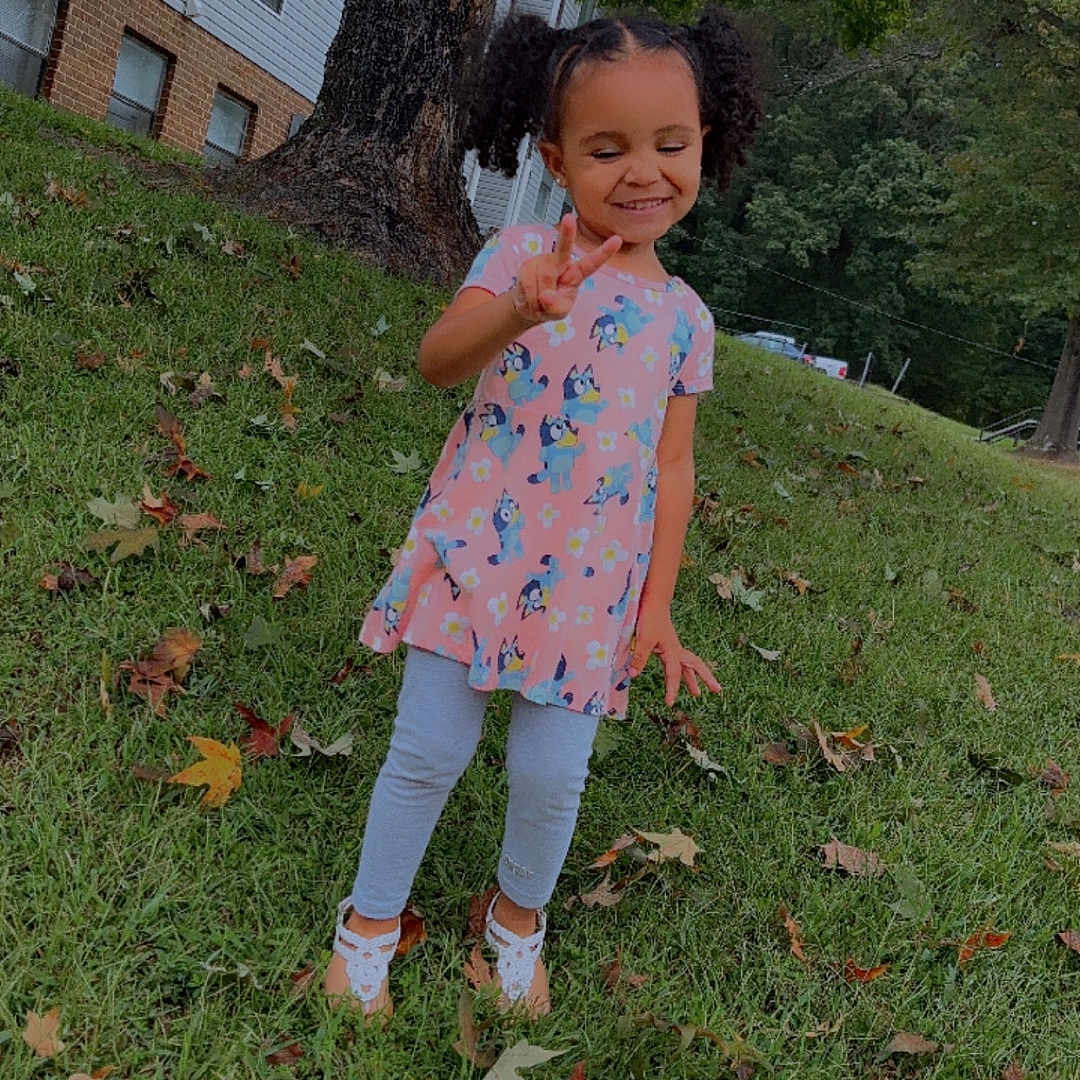 Princess is registered to the contest to win money with this photo: backyard, child, clothing, dress, face, female, girl, grass, head, lawn, leaf, nature, outdoors, pants, person, photography, plant, portrait, tree, yard