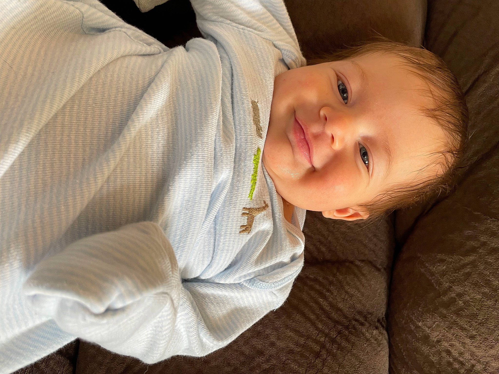 Kamali is registered to the contest to win money with this photo: arm, baby, baby_laughing, baby_toddler_clothing, cheek, child, collar, comfort, flash_photography, flooring, happy, human_body, iris, joy, lip, nose, person, sitting, sleeve, smile