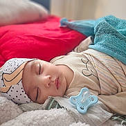 Osiyo is registered to the contest to win money with this photo: baby, sleeping, blanket, pacifier, hat, cozy, infant, cute, soft, resting, child, bed, comfort, toddler, warm, indoors, peaceful, portrait, clothing, closeup