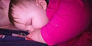 Charlotte Elishka is registered to the contest to win money with this photo: baby, sleeping, child, infant, person, closeup, pink_clothing, peaceful, resting, cozy, portrait, face, hand, young_child, cuddling, indoor, soft_light, tender_moment, human, parent